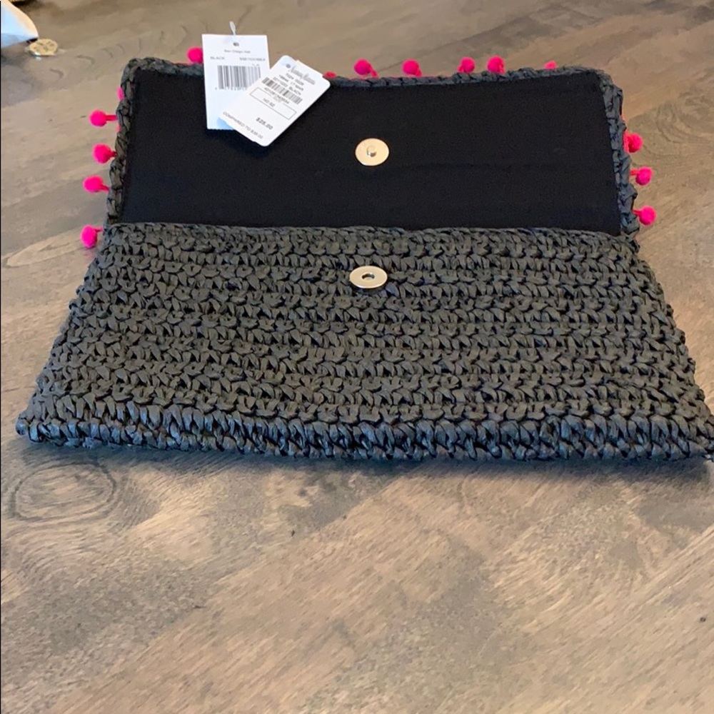 Black straw-like clutch with pink Pom-Pom trim - Picture 3 of 5